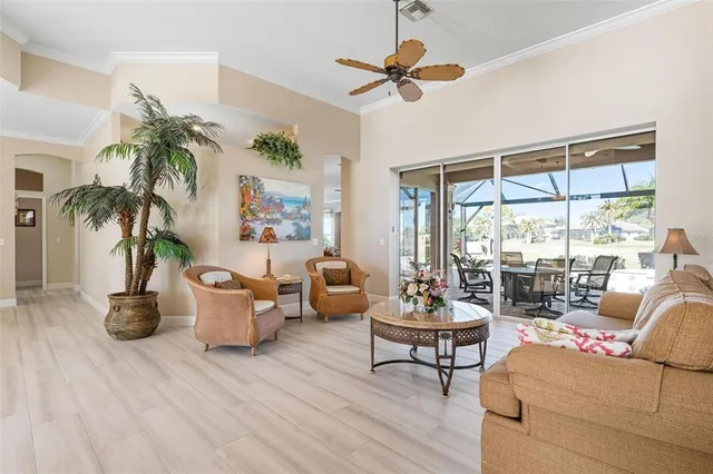 a kitchen with stainless steel appliances granite countertop a refrigerator a stove a sink and a microwave