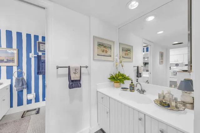 a bathroom with a sink double vanity and shower