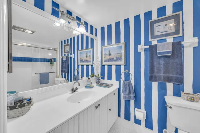 a bathroom with a sink double vanity and a shower