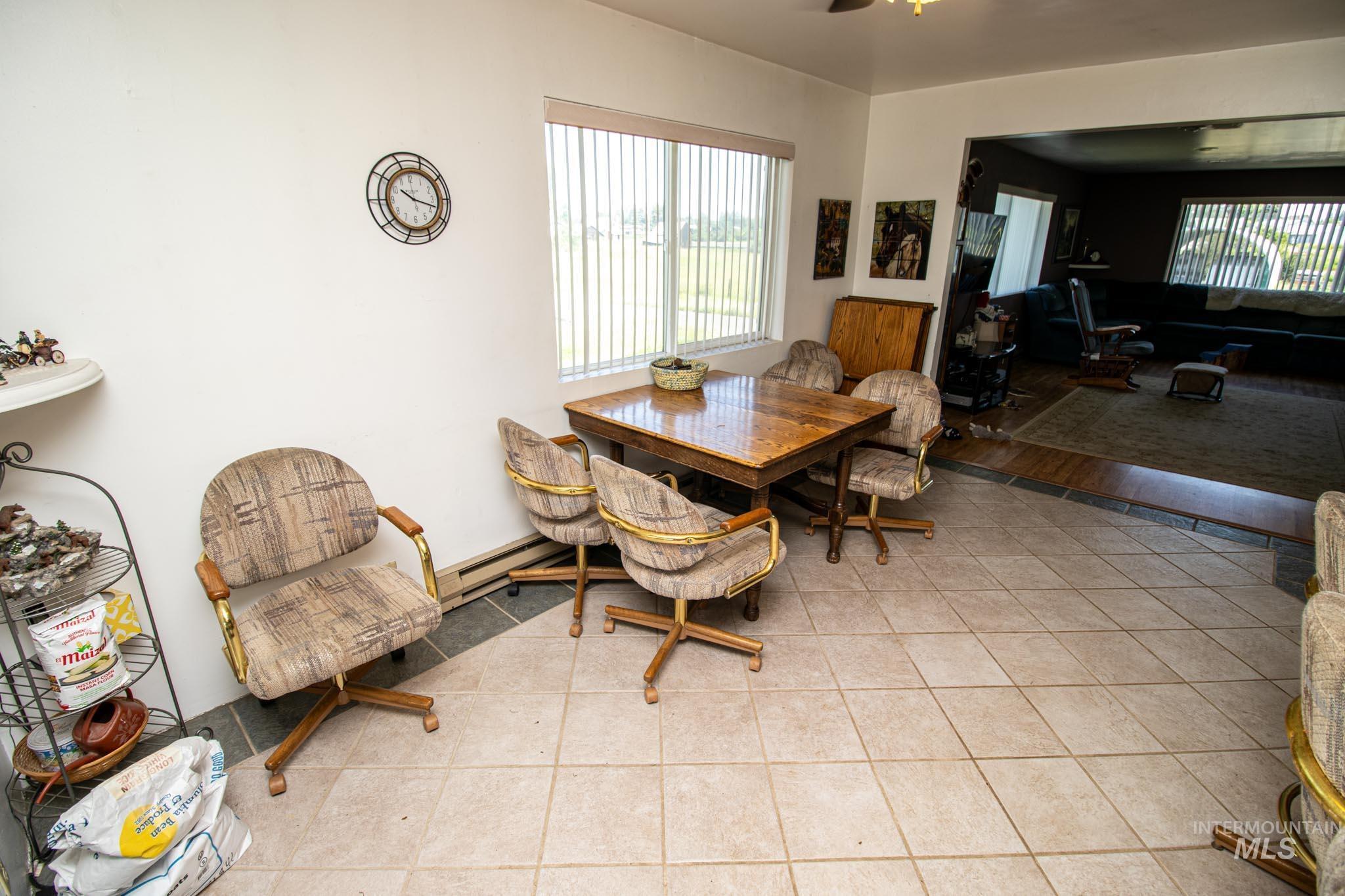 105 Weippe Avenue Weippe, ID 83553 - Photo 16 of 43 Tiled dining area featuring plenty of natural light and ceiling fan