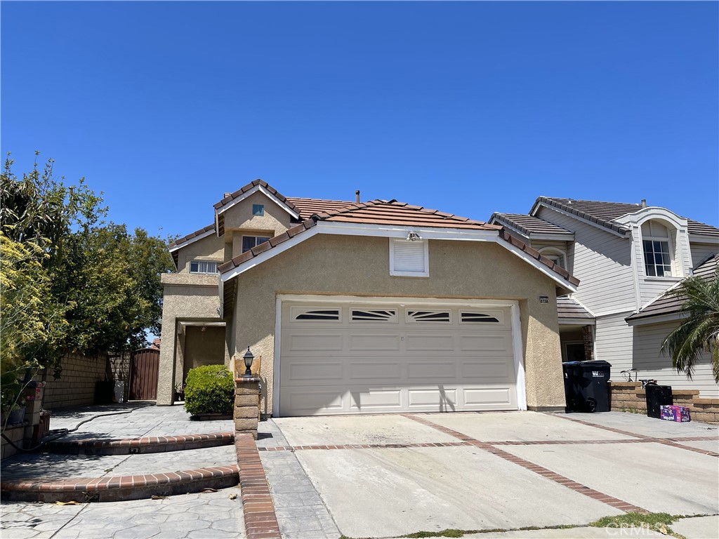 6738 Wrangler Road Chino Hills, CA 91709 - Photo 1 of 4 a front view of a house with a garage