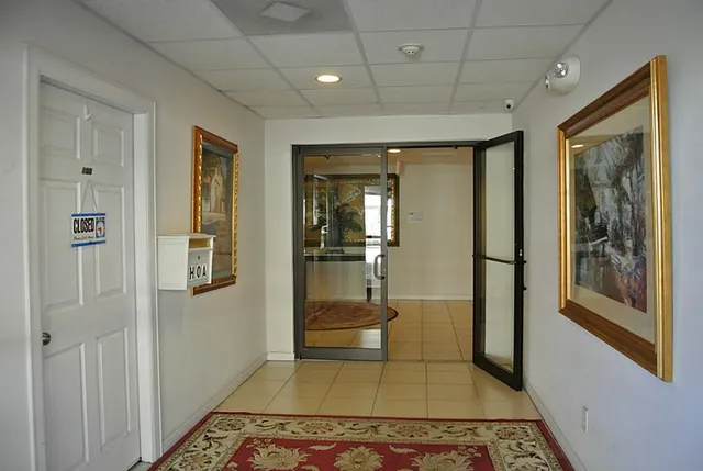 a bathroom with a glass door shower