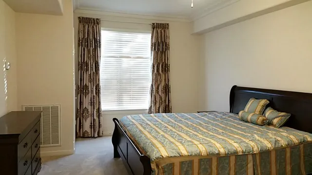 a kitchen with stainless steel appliances granite countertop a refrigerator stove top oven and granite countertops