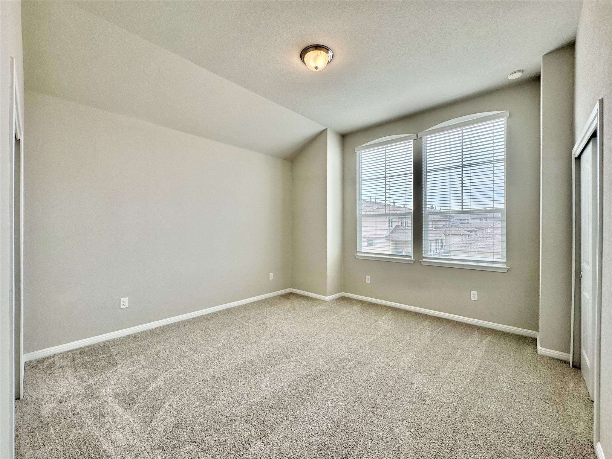 407 Rhetoric Way Pflugerville, TX 78660 - Photo 17 of 38 a view of an empty room with a window