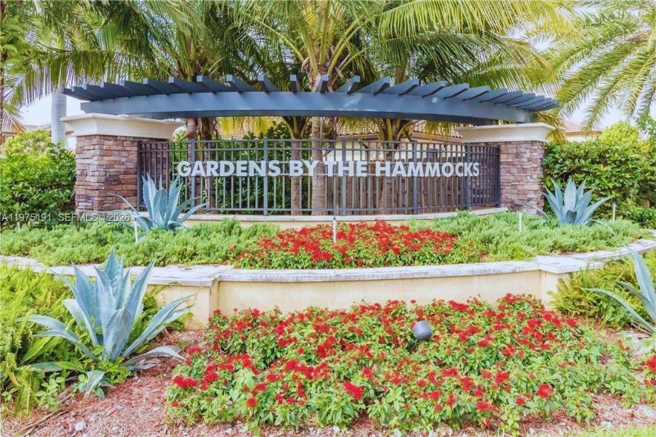 a wooden fence with some plants
