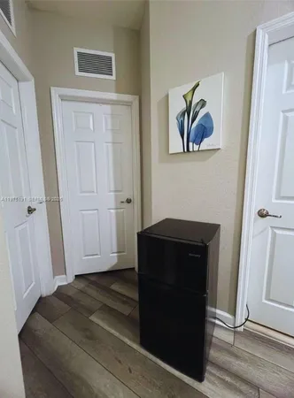 a bedroom with a bed and a ceiling fan