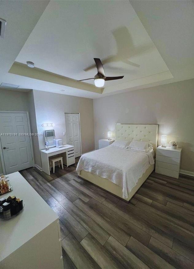 15076 Southwest 117th Terrace Miami, FL 33196 - Photo 17 of 31 a bedroom with a bed and a ceiling fan