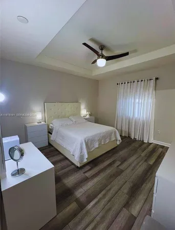 a bedroom with furniture and a bathtub