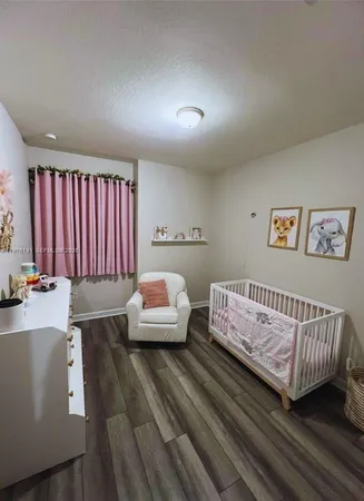 a bedroom with a bed and dresser