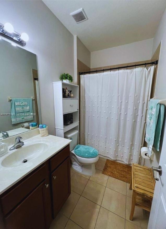 15076 Southwest 117th Terrace Miami, FL 33196 - Photo 25 of 31 a bathroom with a sink a toilet and shower