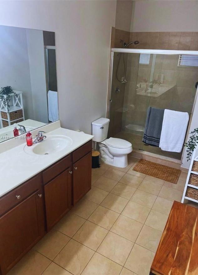 15076 Southwest 117th Terrace Miami, FL 33196 - Photo 26 of 31 a bathroom with a sink toilet and shower