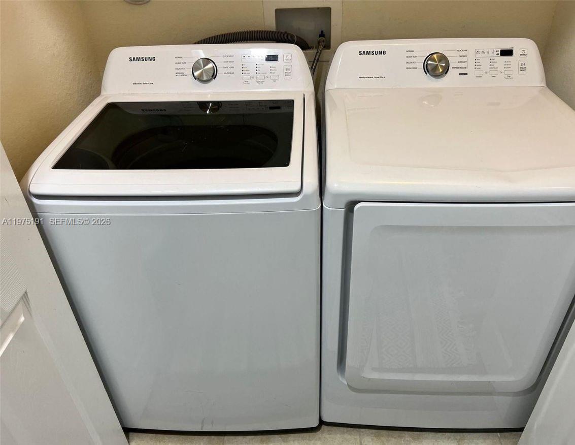 15076 Southwest 117th Terrace Miami, FL 33196 - Photo 28 of 31 a utility room with dryer and washer