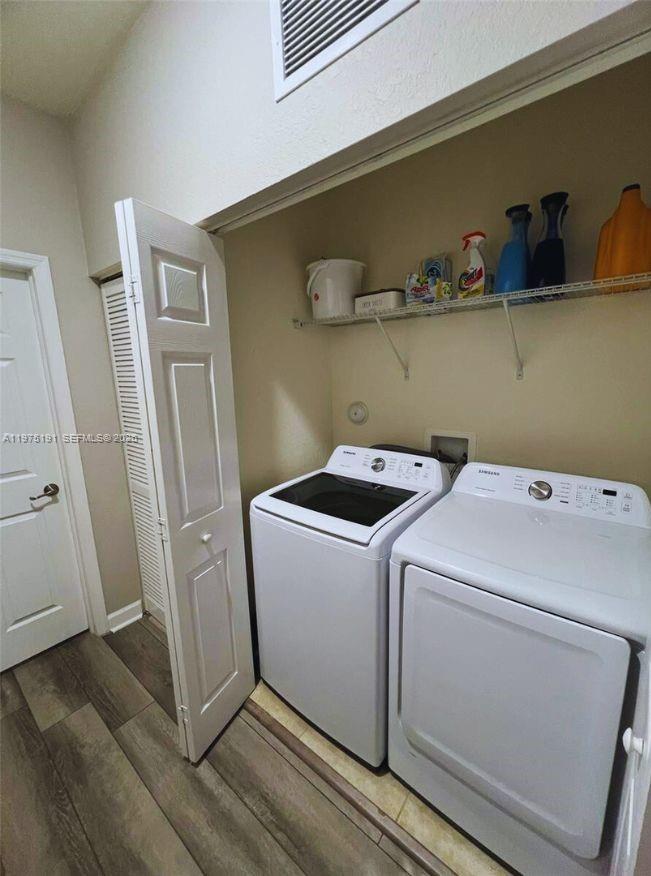 15076 Southwest 117th Terrace Miami, FL 33196 - Photo 29 of 31 a utility room with dryer and washer