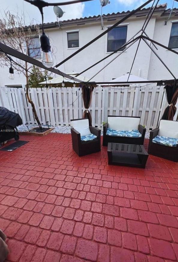 15076 Southwest 117th Terrace Miami, FL 33196 - Photo 30 of 31 a view of front door with couch and chairs