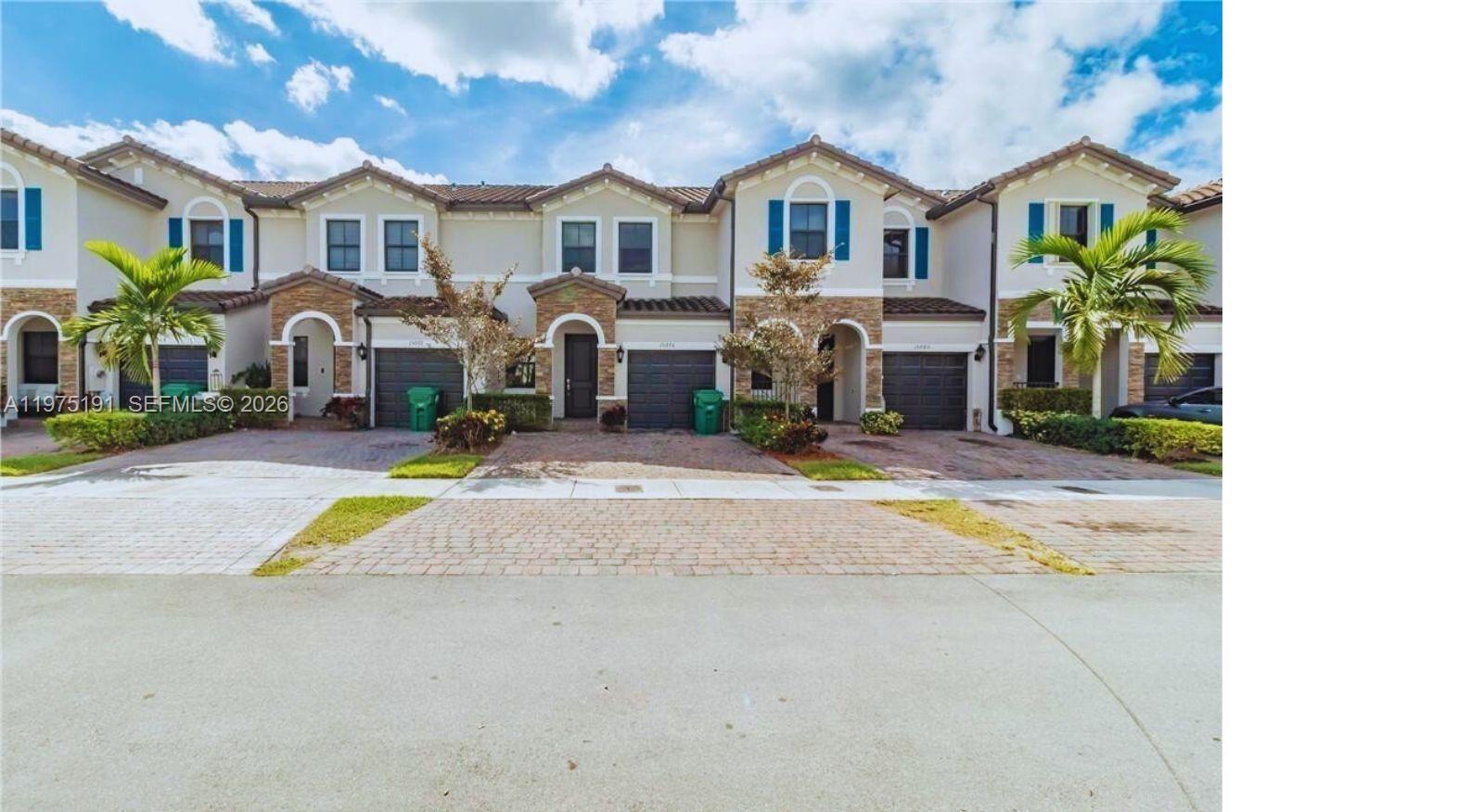 15076 Southwest 117th Terrace Miami, FL 33196 - Photo 3 of 31 a view of multiple houses with a yard