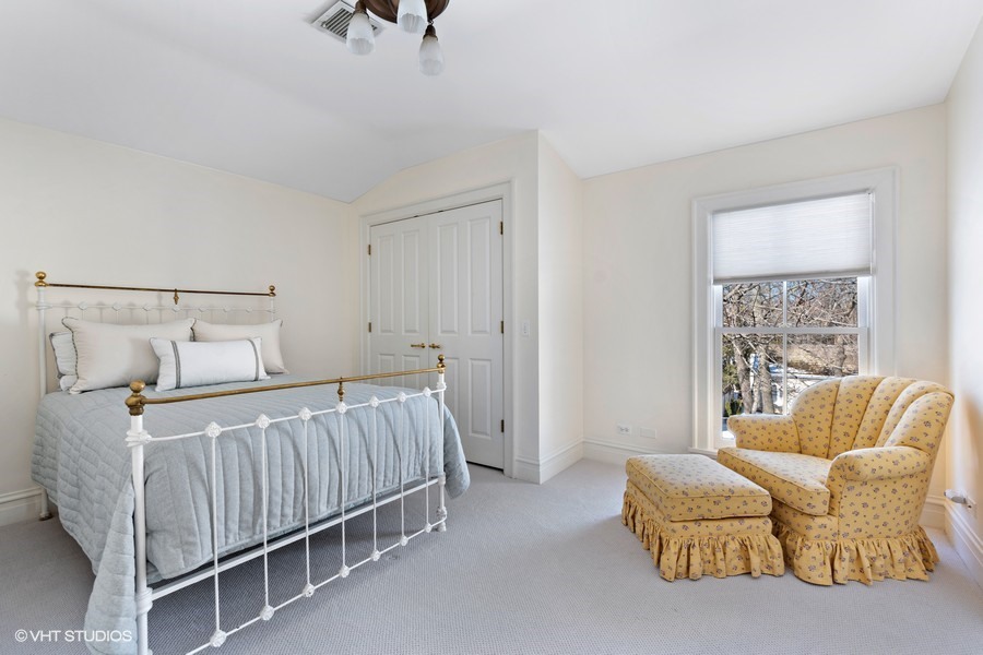 750 Glencoe Drive Glencoe, IL 60022 - Photo 18 of 26 a bedroom with a bed and a couch