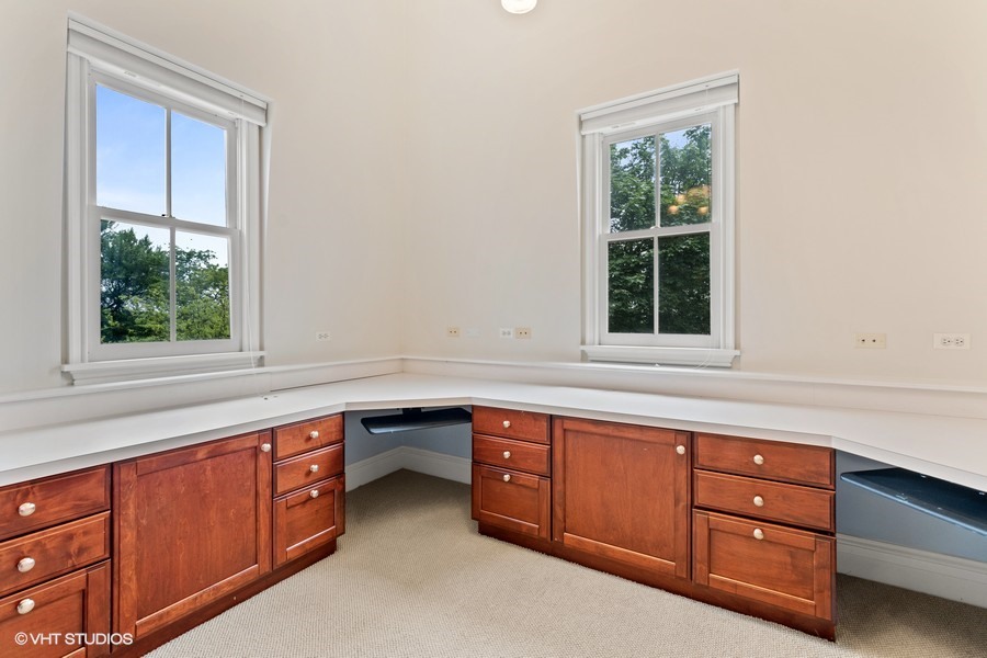 750 Glencoe Drive Glencoe, IL 60022 - Photo 21 of 26 a kitchen with stainless steel appliances granite countertop cabinets and window