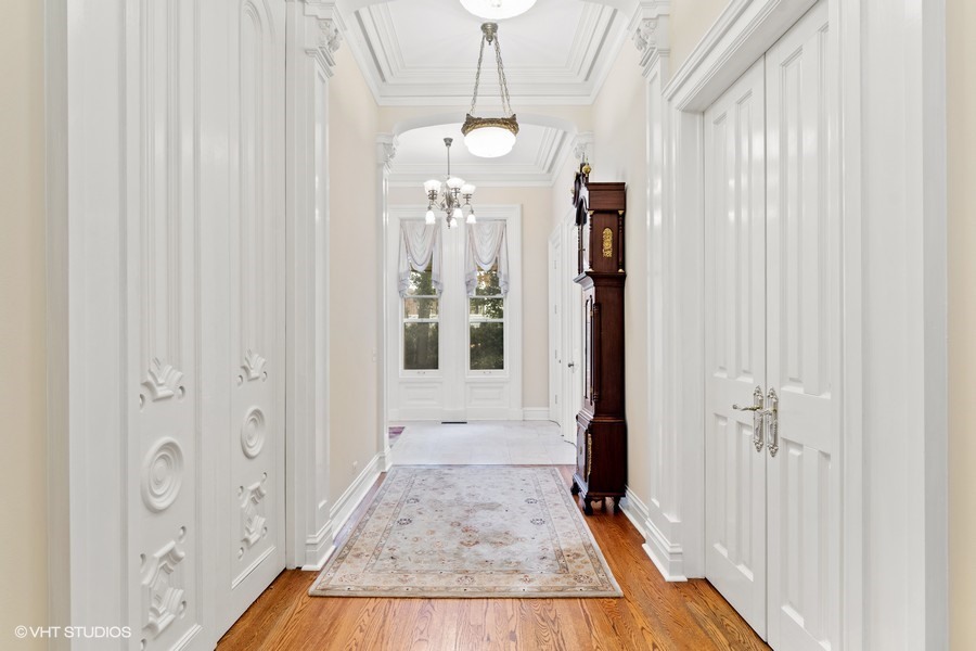 750 Glencoe Drive Glencoe, IL 60022 - Photo 4 of 26 a view of a hallway with wooden floor and staircase