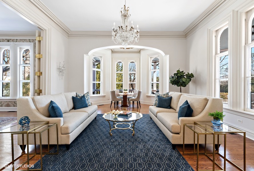 750 Glencoe Drive Glencoe, IL 60022 - Photo 5 of 26 a living room with furniture a chandelier and wooden floor
