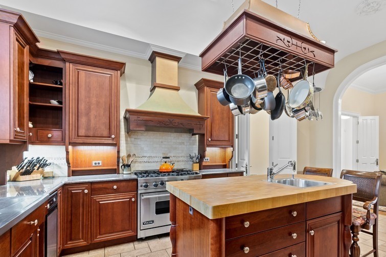 750 Glencoe Drive Glencoe, IL 60022 - Photo 8 of 26 a kitchen with a sink and cabinets