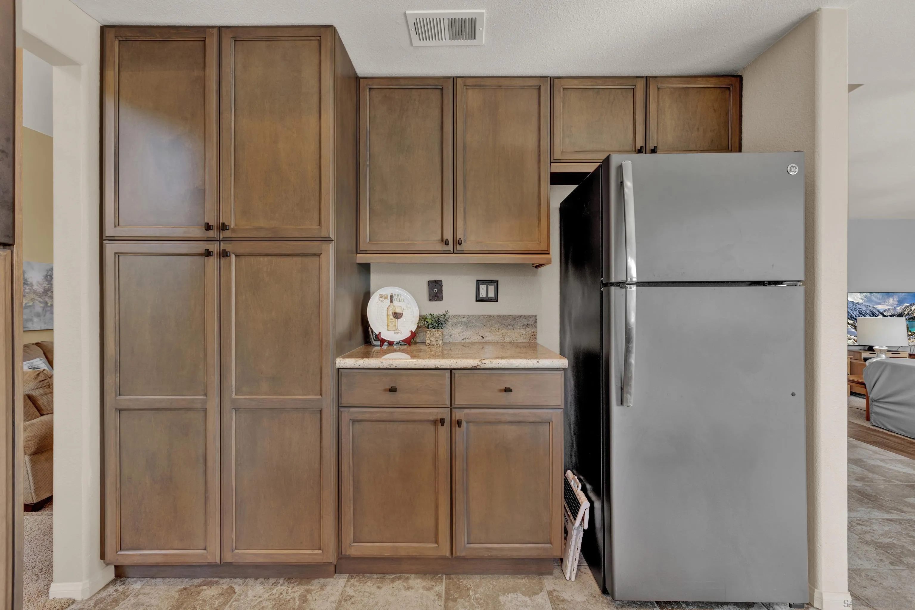 15550 Garden Road Poway, CA 92064 - Photo 13 of 48 a white refrigerator freezer and a cabinets in a kitchen
