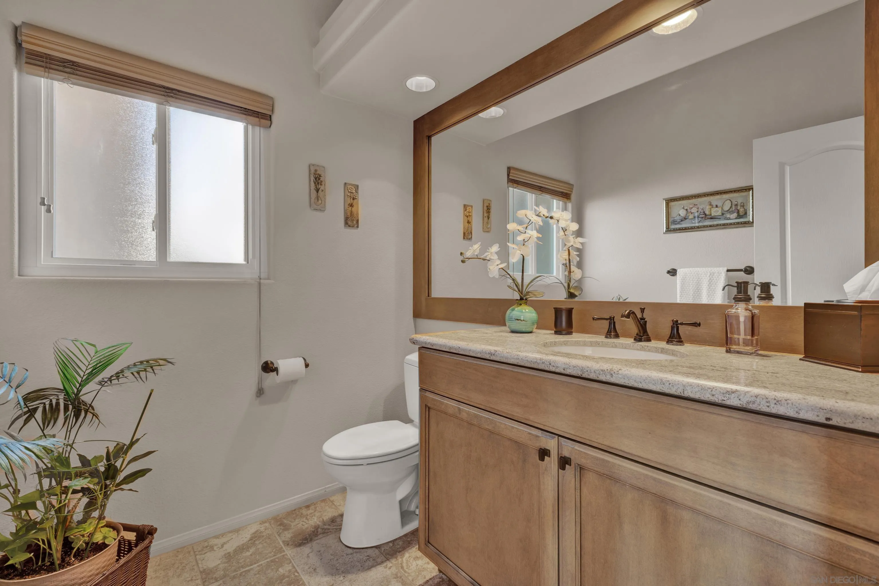 15550 Garden Road Poway, CA 92064 - Photo 22 of 48 a bathroom with a granite countertop sink a toilet and with mirror