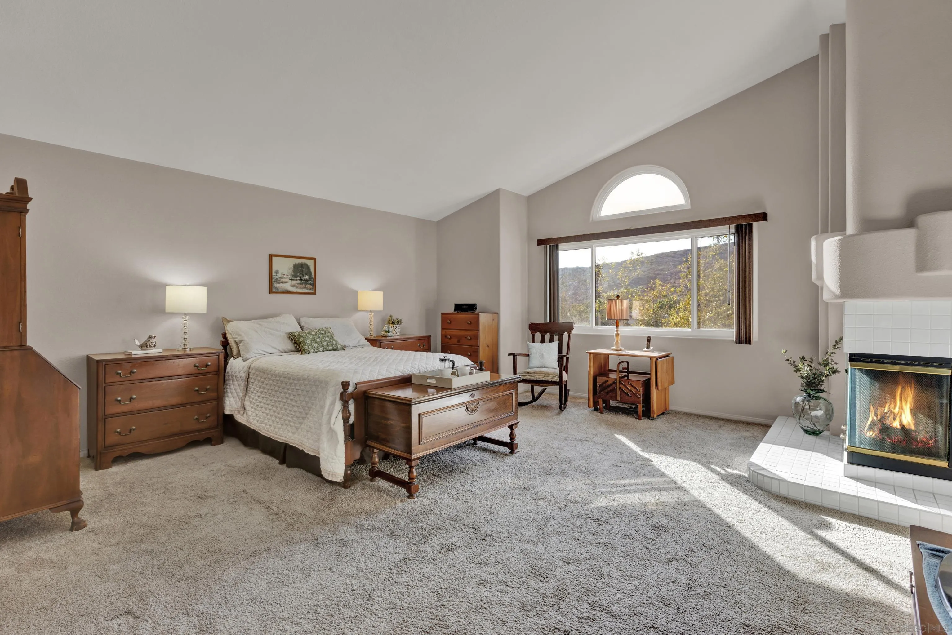 15550 Garden Road Poway, CA 92064 - Photo 25 of 48 a spacious bedroom with a bed and a fireplace