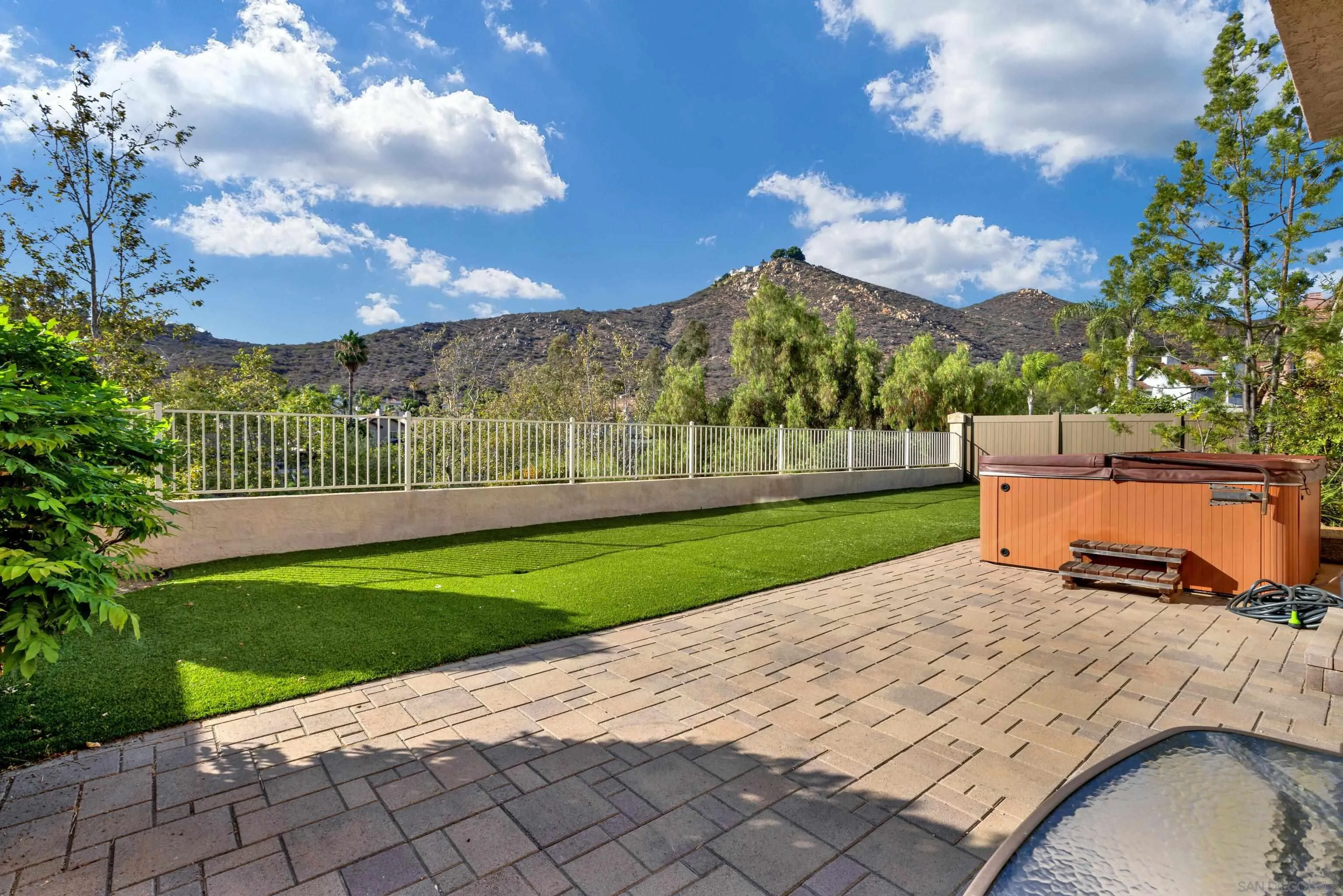 15550 Garden Road Poway, CA 92064 - Photo 3 of 48 a view of a garden with a building in the background