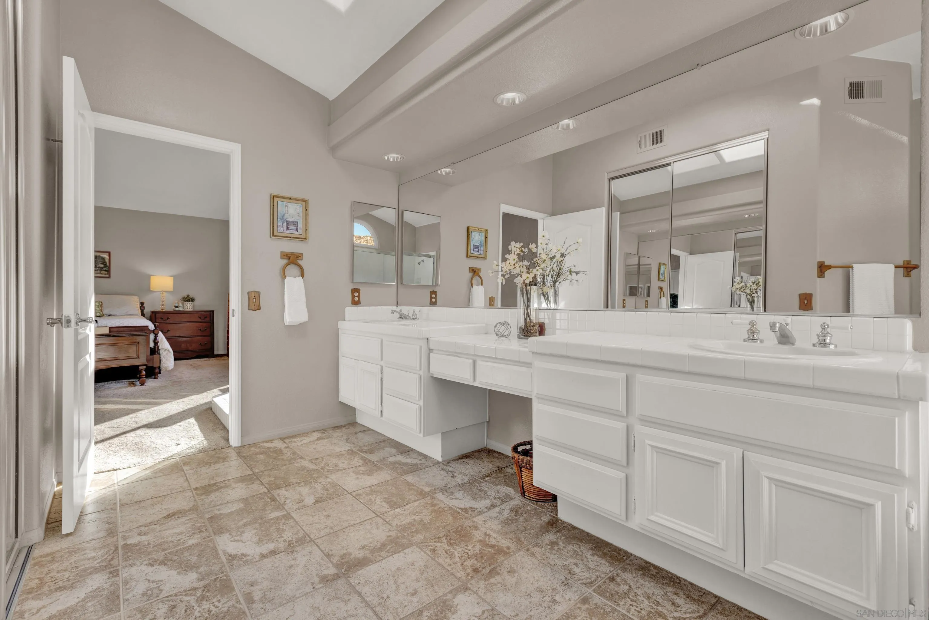 15550 Garden Road Poway, CA 92064 - Photo 31 of 48 a bathroom with a sink double vanity and a mirror