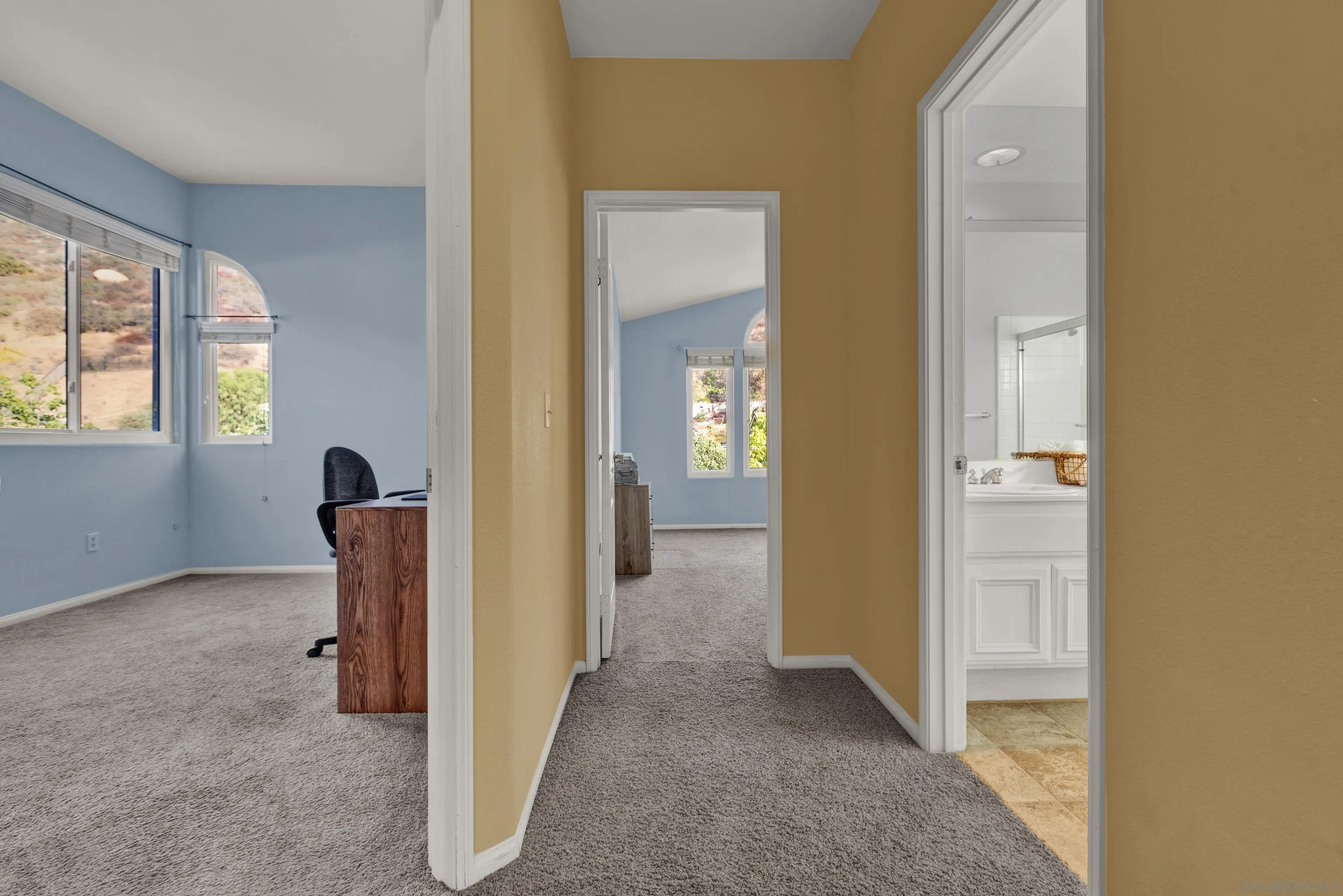 15550 Garden Road Poway, CA 92064 - Photo 36 of 48 a view of a hallway with windows
