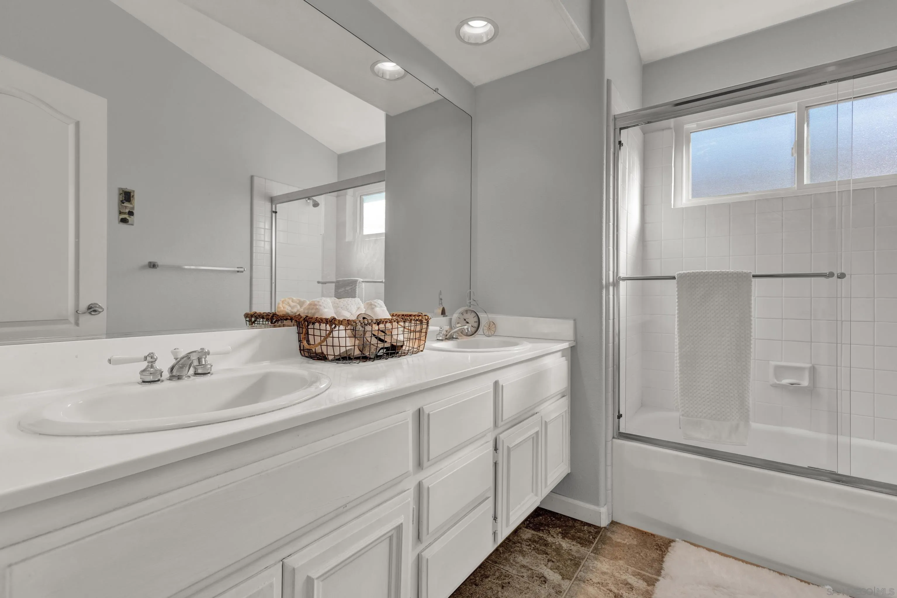 15550 Garden Road Poway, CA 92064 - Photo 40 of 48 a bathroom with a double vanity sink and a mirror