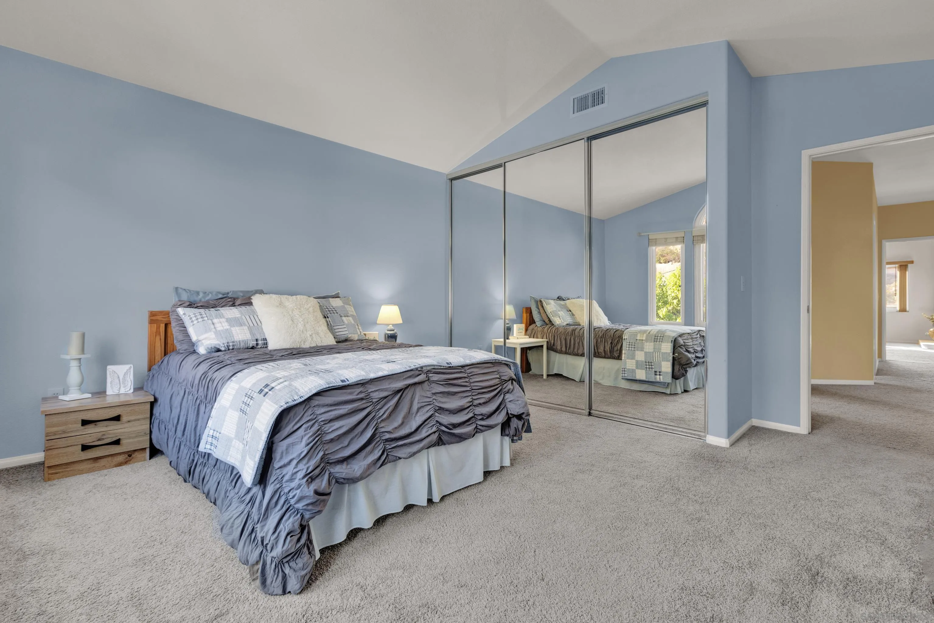 15550 Garden Road Poway, CA 92064 - Photo 42 of 48 a spacious bedroom with a bed and ceiling fan