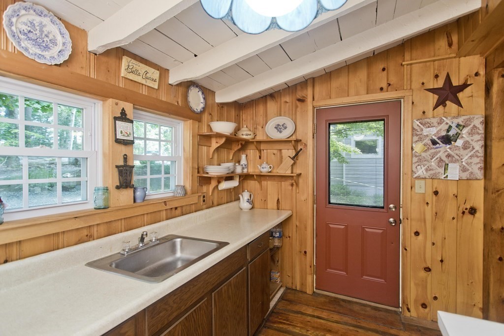 24 Farmhouse Road Chesterfield, MA 01012 - Photo 19 of 42 a kitchen with granite countertop a sink and a window