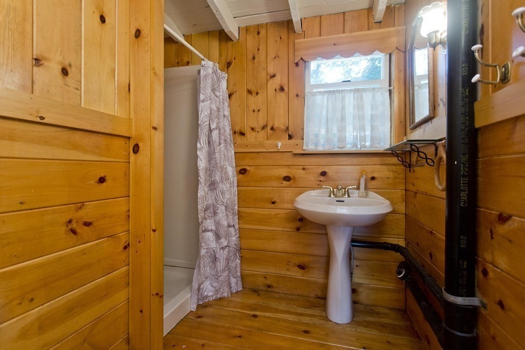 24 Farmhouse Road Chesterfield, MA 01012 - Photo 27 of 42 a bathroom with a sink and a mirror