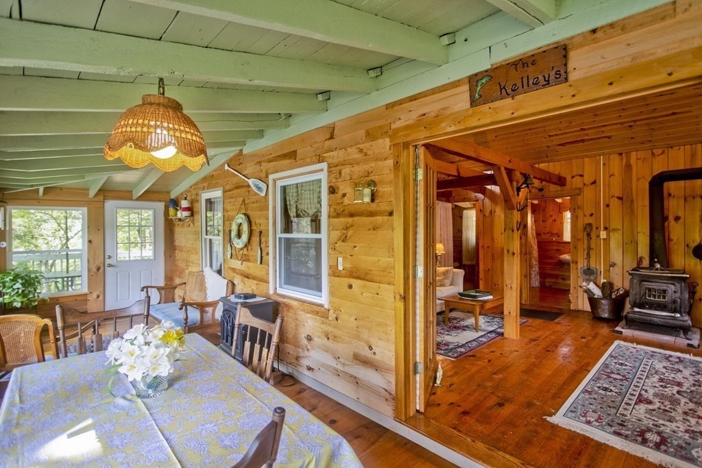 24 Farmhouse Road Chesterfield, MA 01012 - Photo 34 of 42 a dining room with wooden floor and furniture
