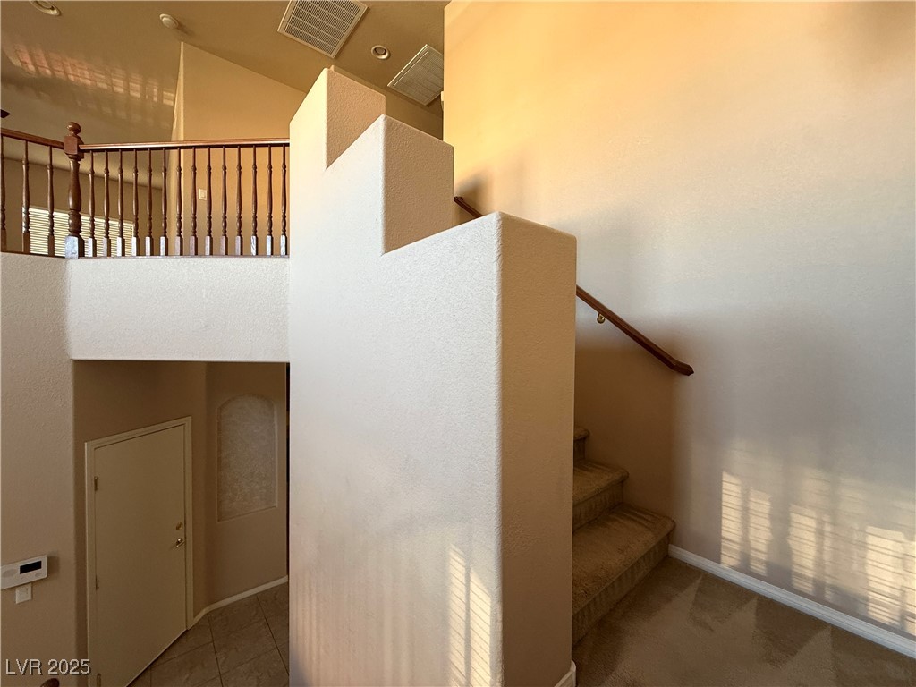 6031 Lamotte Avenue Las Vegas, NV 89141 - Photo 14 of 28 Staircase with baseboards