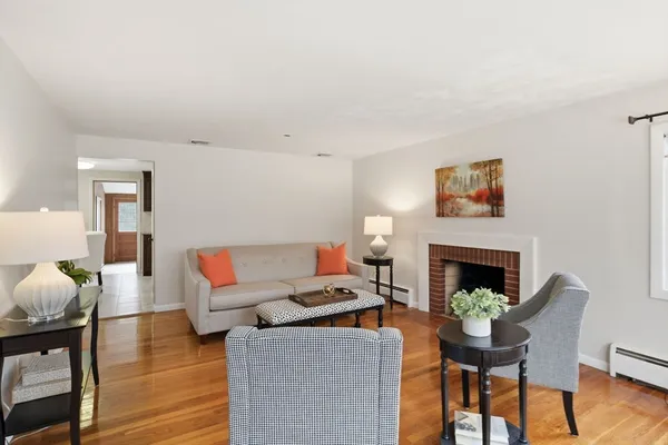 a living room with furniture and a fireplace