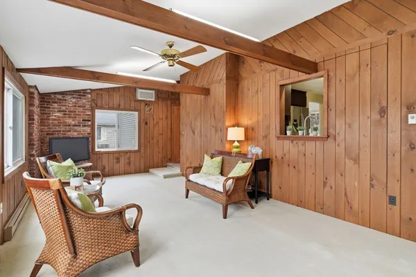 a living room with furniture and a window