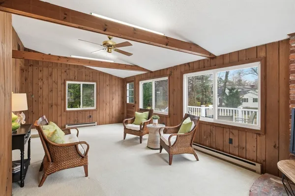 a living room with furniture and windows