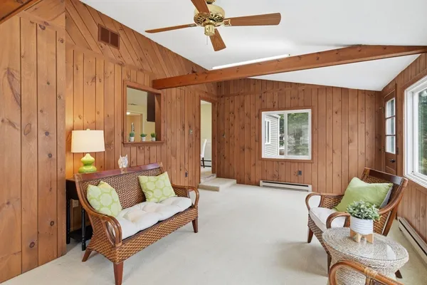 a living room with furniture and a window