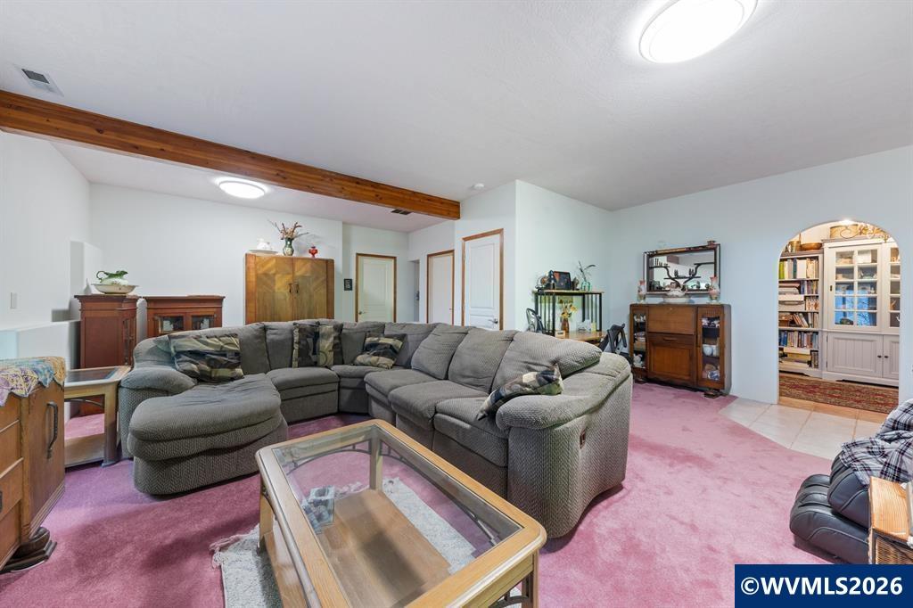 6100 Teal Creek Road Dallas, OR 97338 - Photo 24 of 41 a living room with furniture and a couch