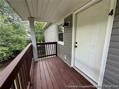 a view of balcony with wooden floor