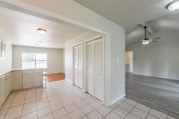 a view of a room with window and hardwood floor