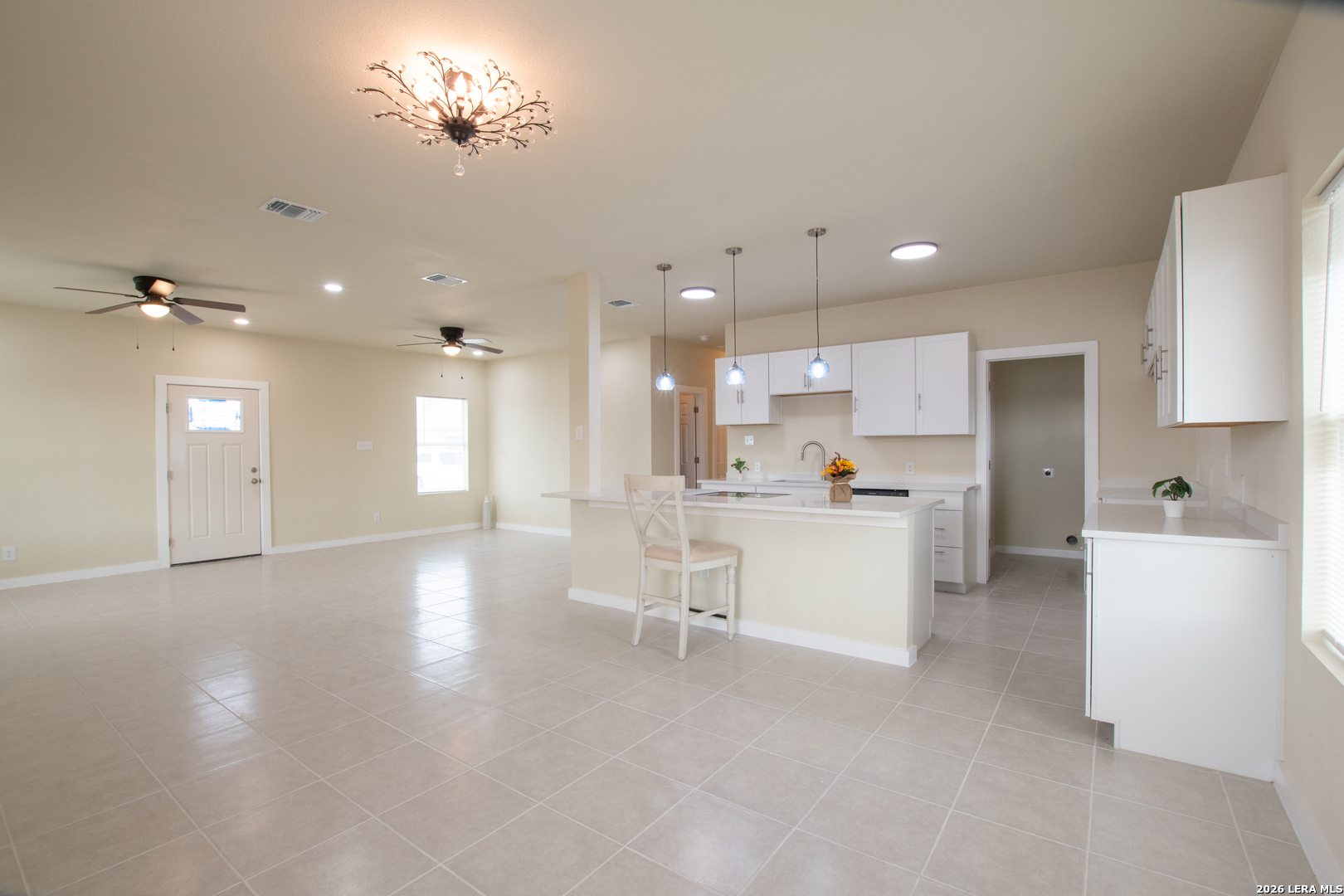 2621 Pahmeyer Road New Braunfels, TX 78130 - Photo 12 of 28 a view of a kitchen with kitchen island a sink stainless steel appliances and cabinets