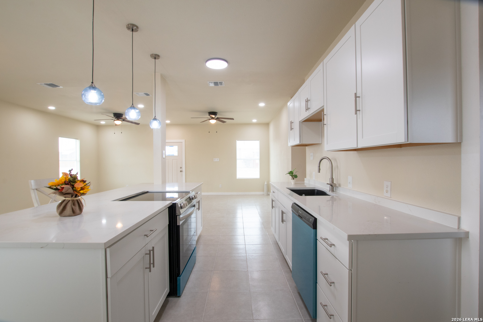 2621 Pahmeyer Road New Braunfels, TX 78130 - Photo 14 of 28 a kitchen with a sink stove and cabinets