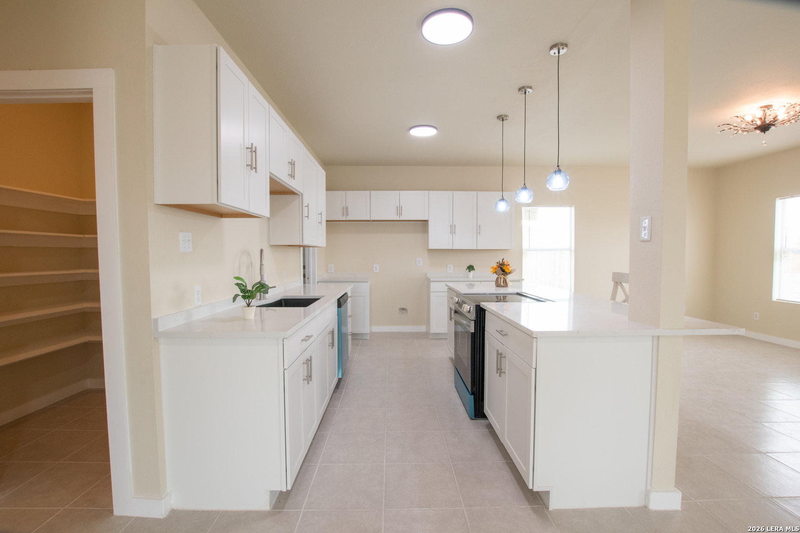 2621 Pahmeyer Road New Braunfels, TX 78130 - Photo 15 of 28 a kitchen with kitchen island a sink stainless steel appliances and cabinets