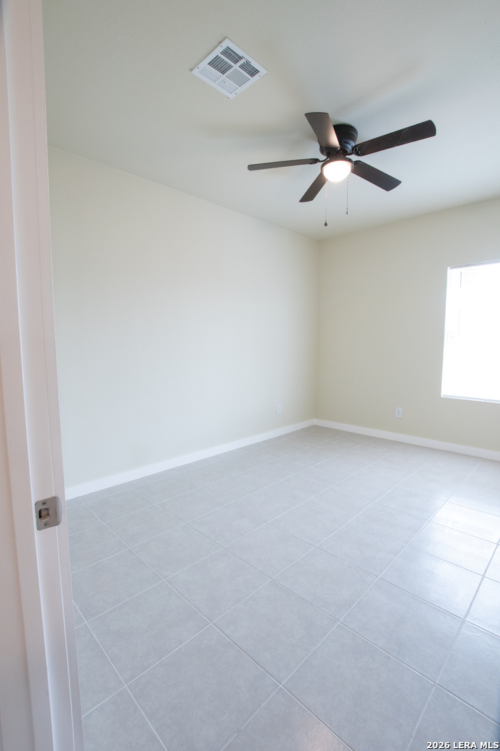2621 Pahmeyer Road New Braunfels, TX 78130 - Photo 21 of 28 an empty room with windows and fan