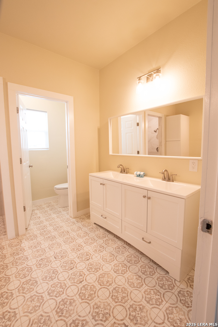 2621 Pahmeyer Road New Braunfels, TX 78130 - Photo 23 of 28 a view of a kitchen with white cabinets