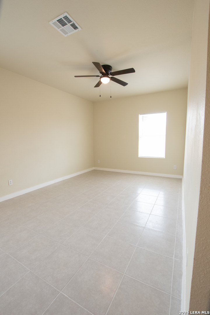 2621 Pahmeyer Road New Braunfels, TX 78130 - Photo 27 of 28 an empty room with a window and a ceiling fan