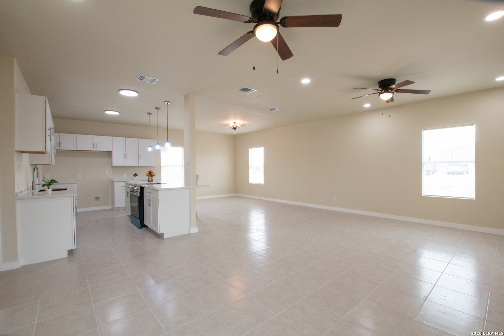 2621 Pahmeyer Road New Braunfels, TX 78130 - Photo 10 of 28 a view of a kitchen with a sink and microwave